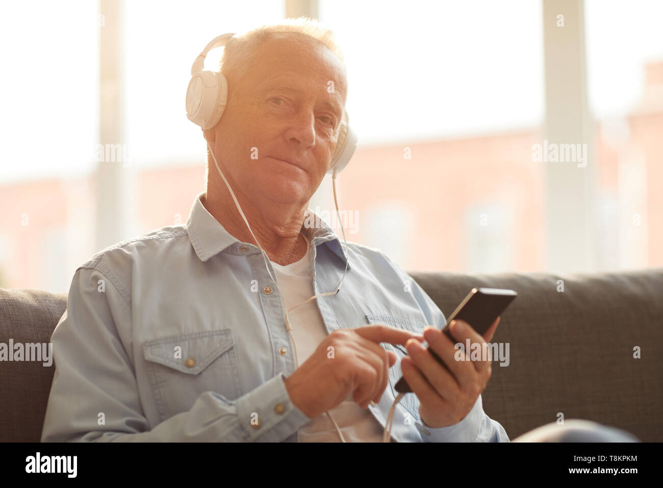 Senior Man Using Technology Stock Photo