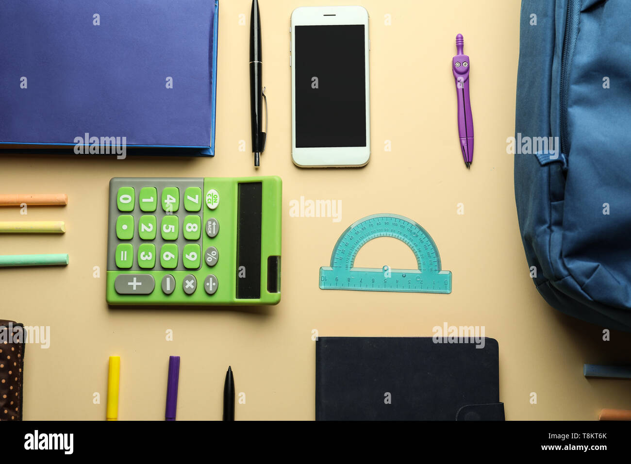Composition with different school stationery and phone on light background Stock Photo