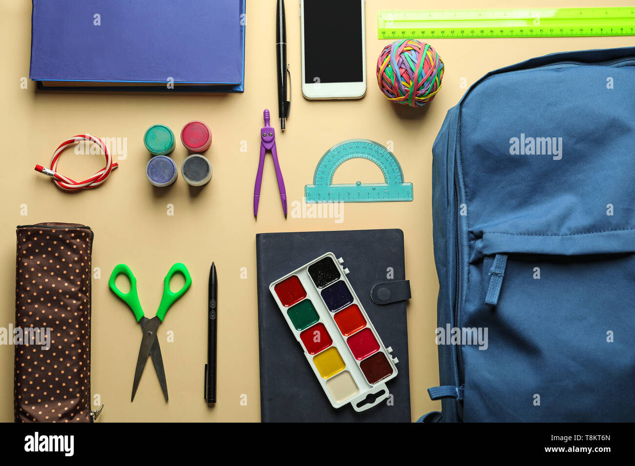 Composition with different school stationery and phone on light background Stock Photo