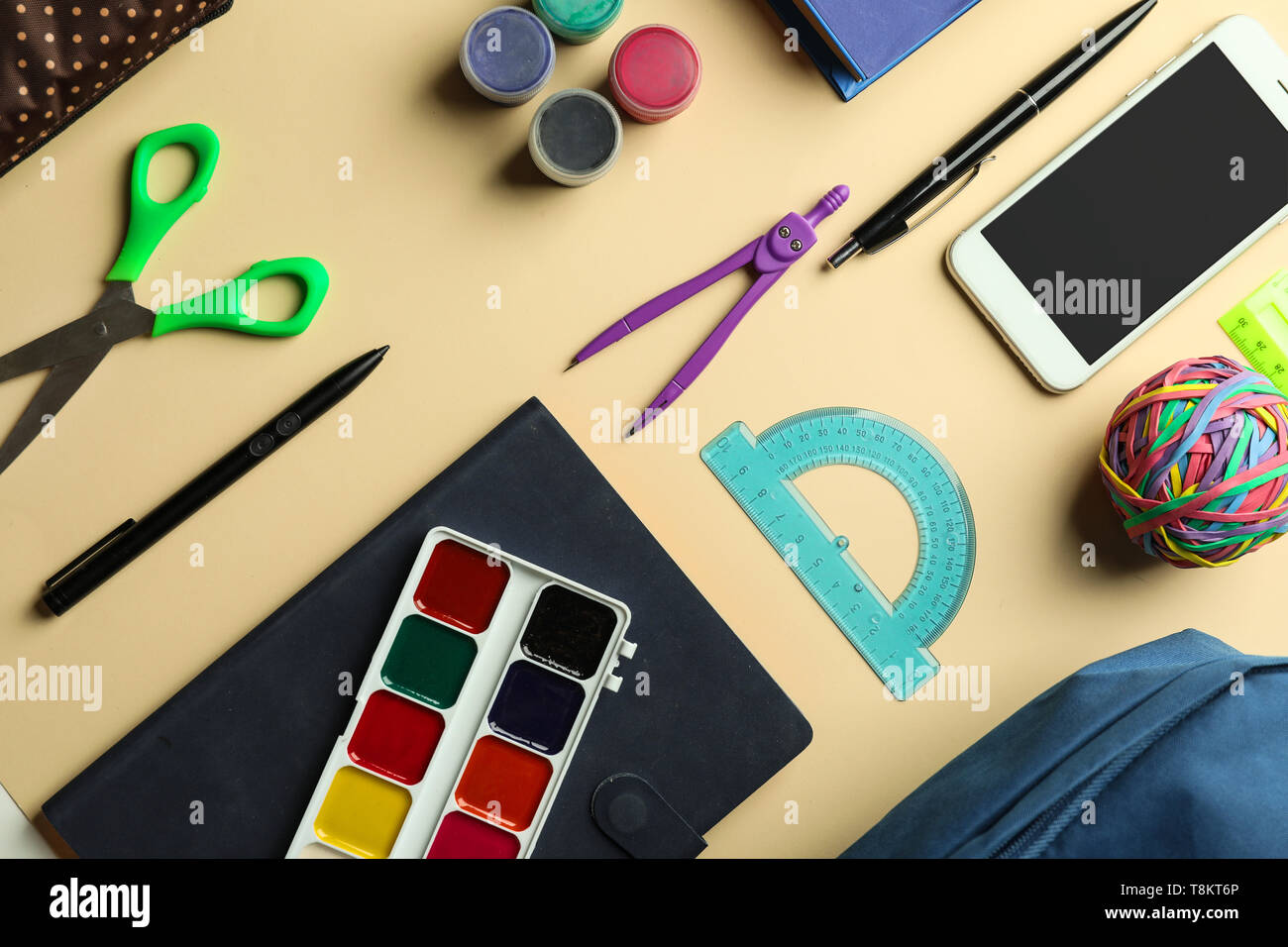 Composition with different school stationery and phone on light background Stock Photo