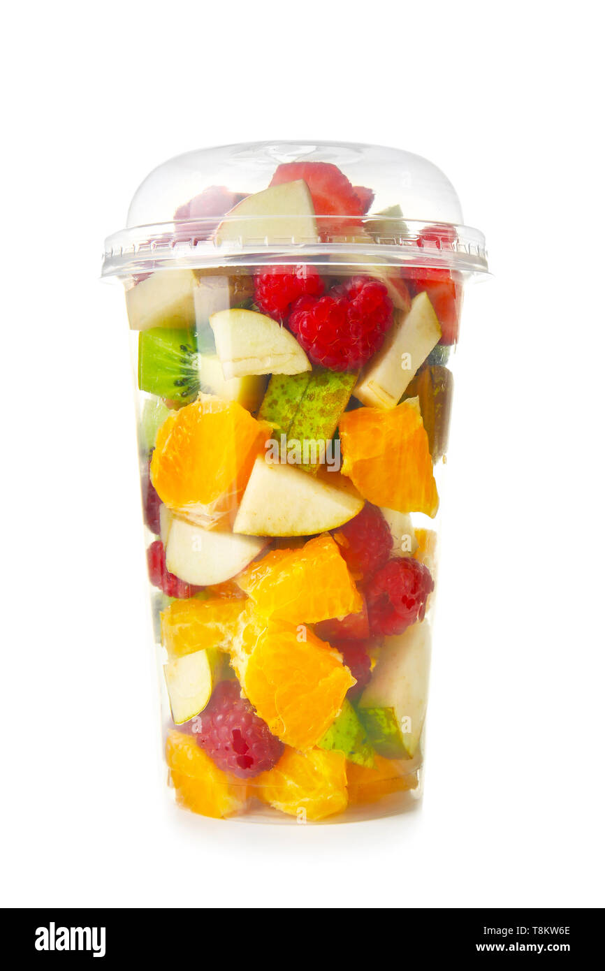 Delicious Fruit Salad In Plastic Cup On White Background Stock Photo