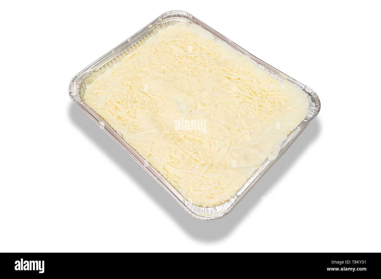 Pre-cooked cold lasagne foil tray. Isolated over white Stock Photo