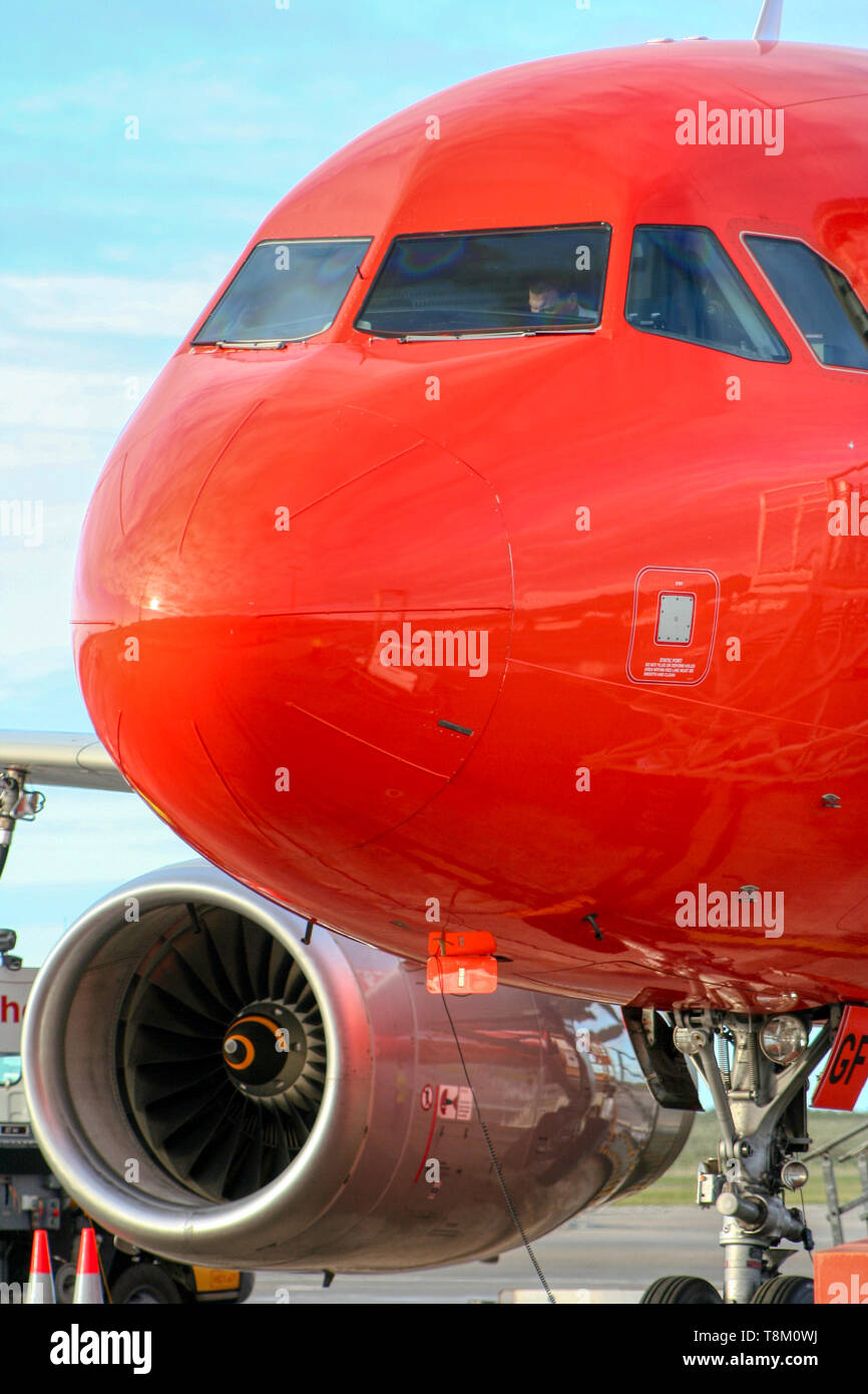 Big red aeroplane, pilots getting ready for take off vertical image Stock Photo