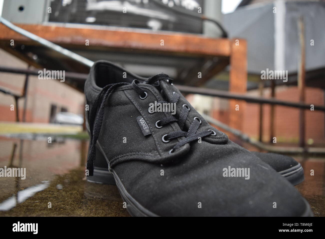 leather sneakers in rain