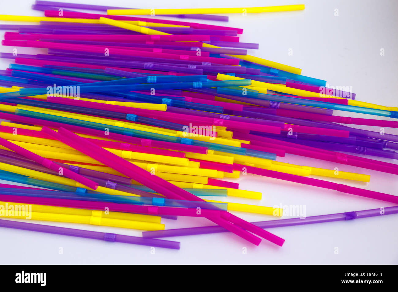 Set of colorful tubes for cocktails. Parallel and perpendicular lie on ...