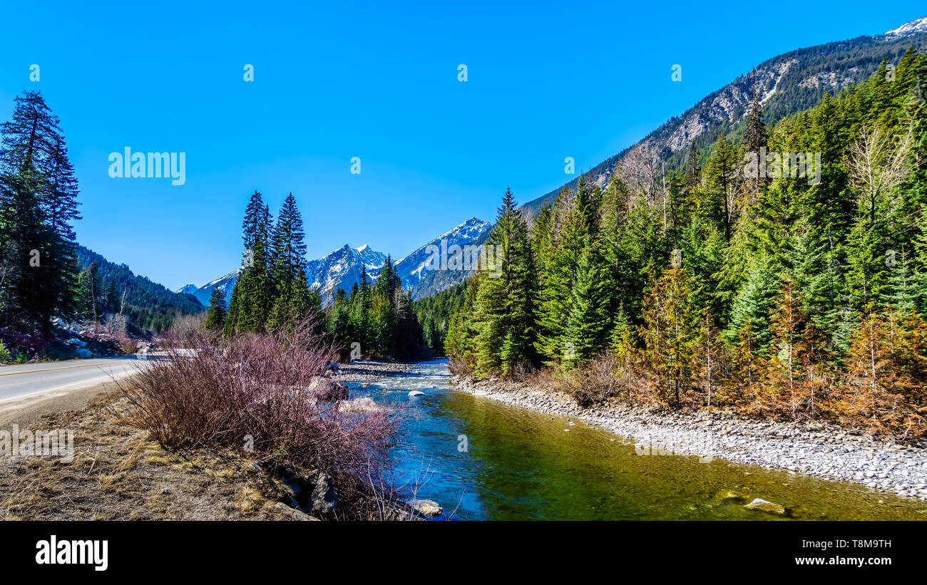 The snow capped Coast Mountains along Highway 99, the Duffey Lake Road, winding through the Coast Mountain Range between Pemberton and Lilloet in BC Stock Photo