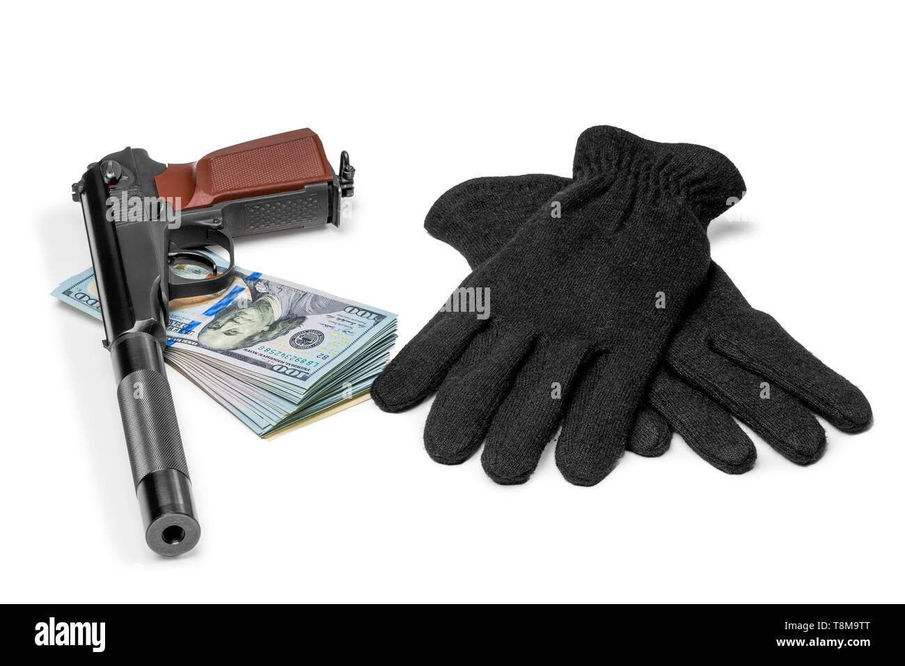 gun with a silencer, money and gloves closeup concept of robbery Stock