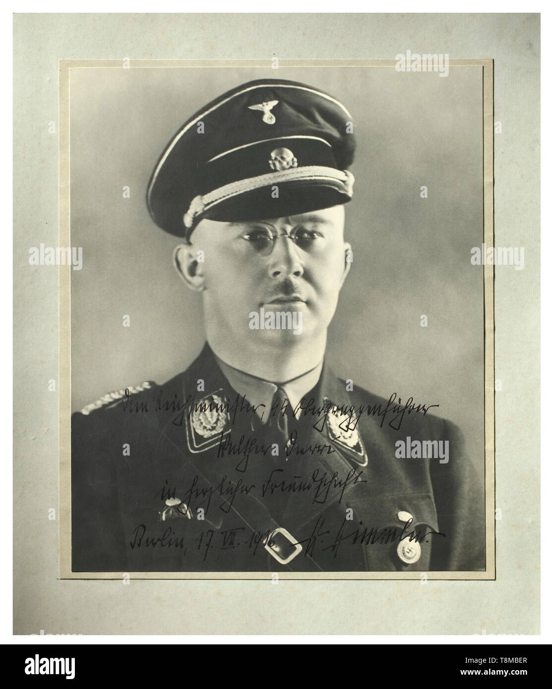 Heinrich Himmer - Walter Darré - a signed portrait Large-size photo of Himmler with dedication (tr.) 'To the Reich Minister SS-Obergruppenführer Walter Darré in cordial friendship Berlin, 17.VII.1936. H. Himmler.' 35 x 30 cm. Due to divergent views, Darré was discharged by 'his friend' Himmler in 1938 from his position as head of the Race and Settlement Office. historic, historical, 20th century, 1930s, NS, National Socialism, Nazism, Third Reich, German Reich, Germany, German, National Socialist, Nazi, Nazi period, fascism, Editorial-Use-Only Stock Photo