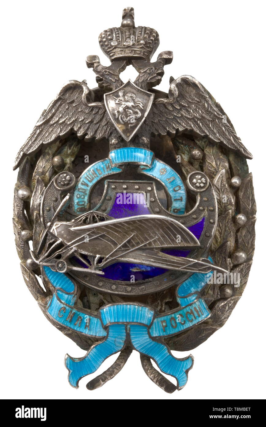 A badge for supporters of the Imperial Russian air fleet Silver and enamel badge fashioned in multiple sections. With threaded disc attachment and pressure plate, punched with the firm name of Eduard in St. Petersburg and a small kokoshnik head, the master's mark illegible. Width 35.8 mm. Weight 34.8 g. historic, historical, medal, decoration, medals, decorations, badge of honour, badge of honor, badges of honour, badges of honor, 20th century, 19th century, Additional-Rights-Clearance-Info-Not-Available Stock Photo