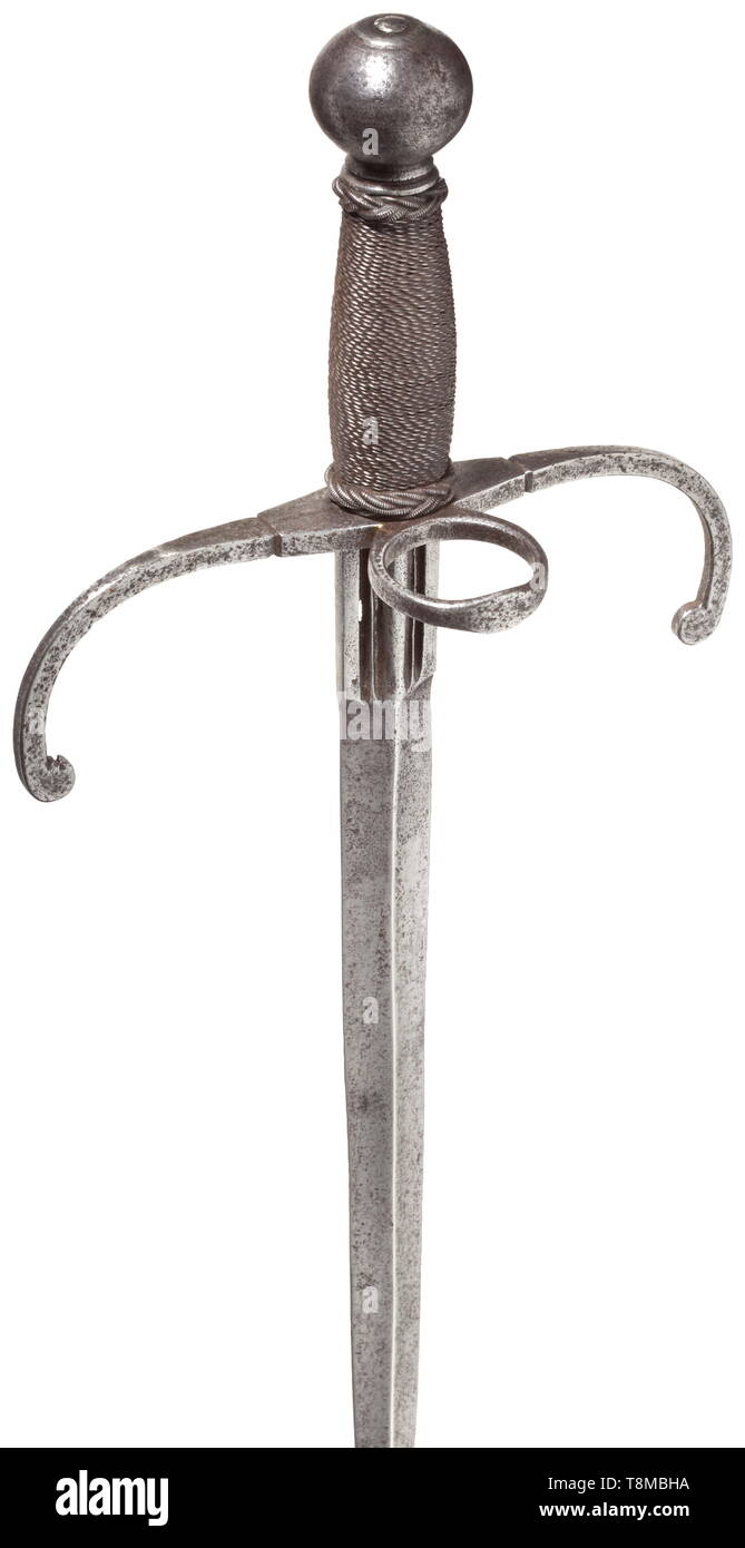 An Italian left-hand dagger, circa 1600 Heavy blade with fullered ricasso. Curved quillons with ring-guard. Older grip with iron wire binding and sturdy Turk's heads. Ball pommel without rivetted finial. Length 43.5 cm. historic, historical, dagger, daggers, thrusting, thrustings, baton, weapon, arms, weapons, arms, fighting device, object, objects, stills, clipping, cut out, cut-out, cut-outs, 17th century, Additional-Rights-Clearance-Info-Not-Available Stock Photo