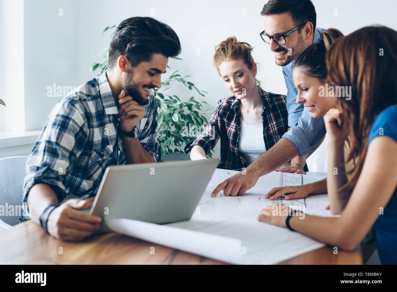 Young architects working on project in office Stock Photo