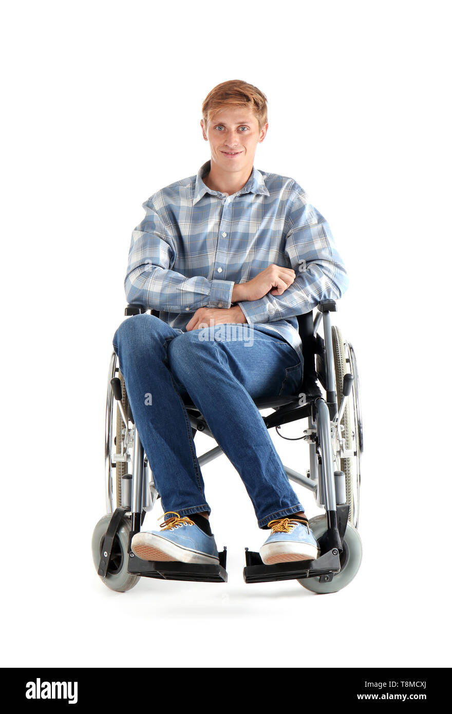 Young man sitting in wheelchair hi-res stock photography and images - Alamy