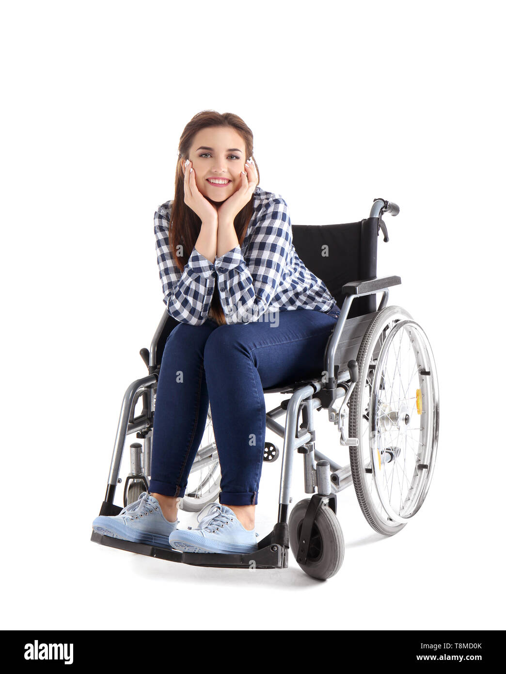 Young woman sitting in wheelchair on white background Stock Photo - Alamy