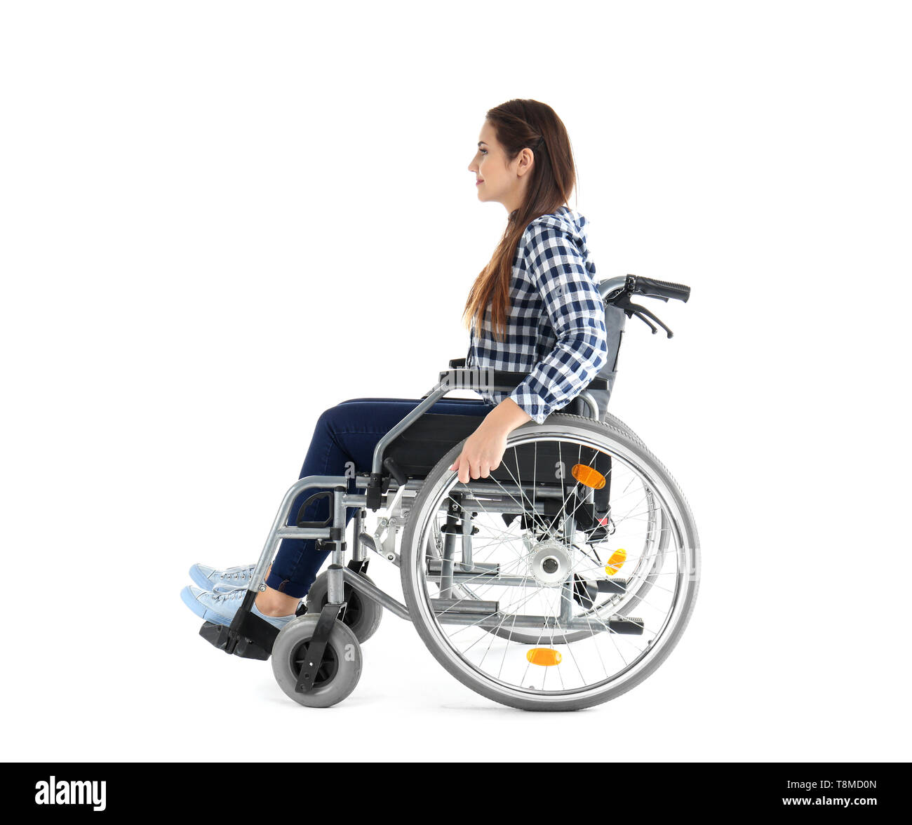 Young woman sitting in wheelchair on white background Stock Photo - Alamy