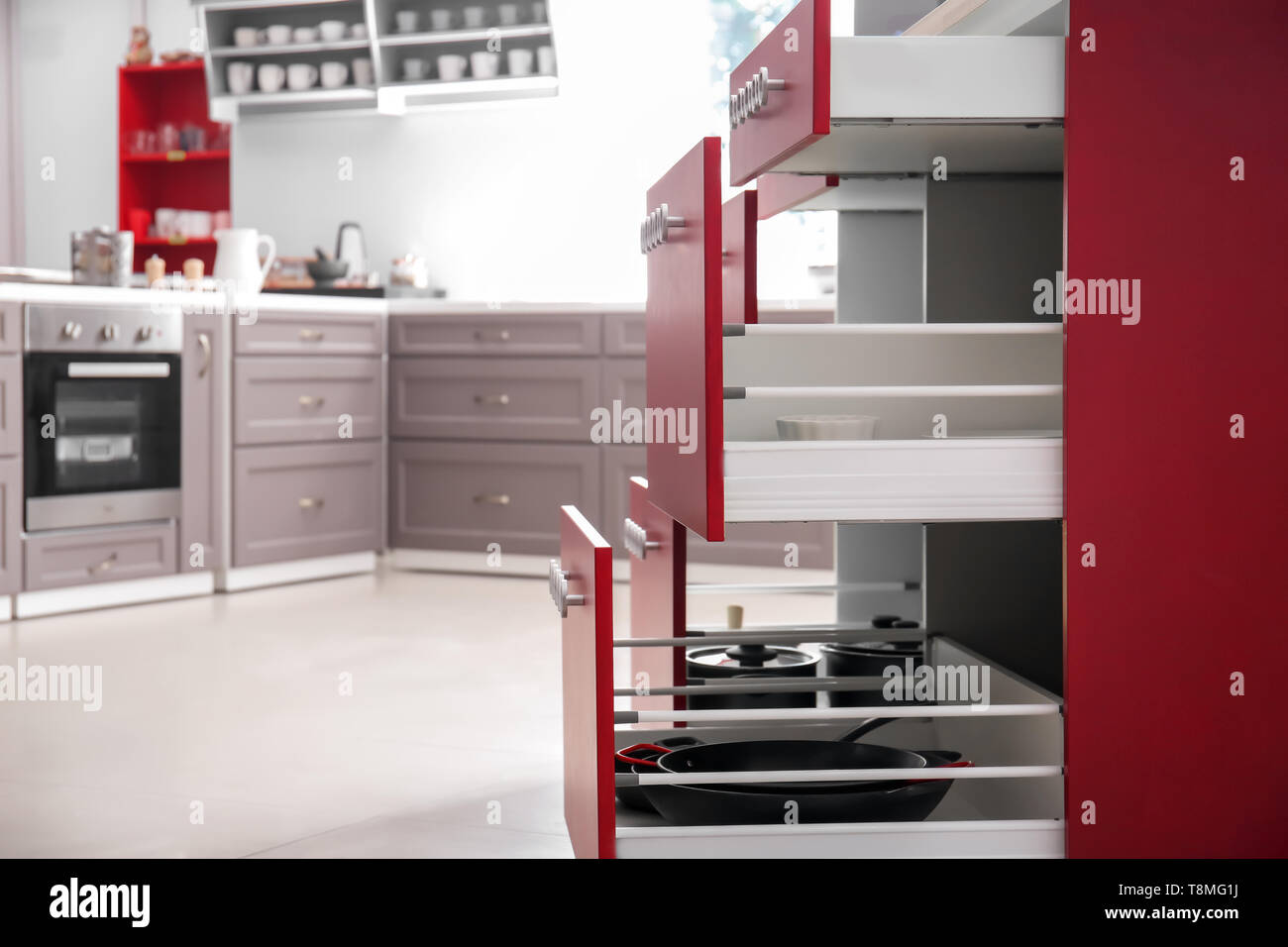 Set of clean kitchenware in open drawers Stock Photo - Alamy