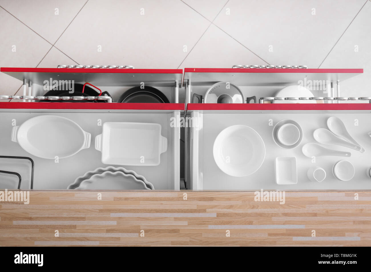 Set of clean kitchenware in drawers Stock Photo - Alamy