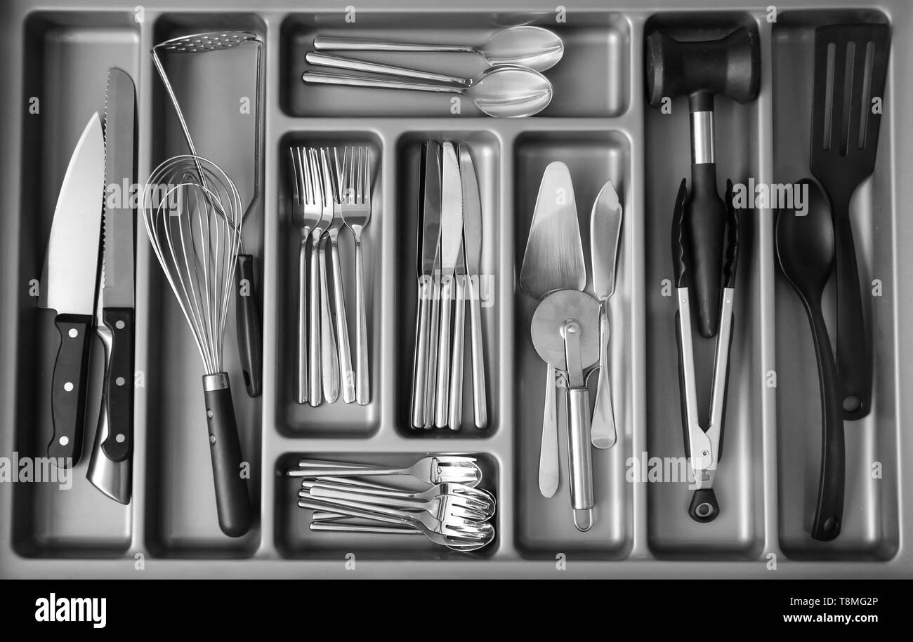 Set of clean kitchen utensils in drawer Stock Photo Alamy