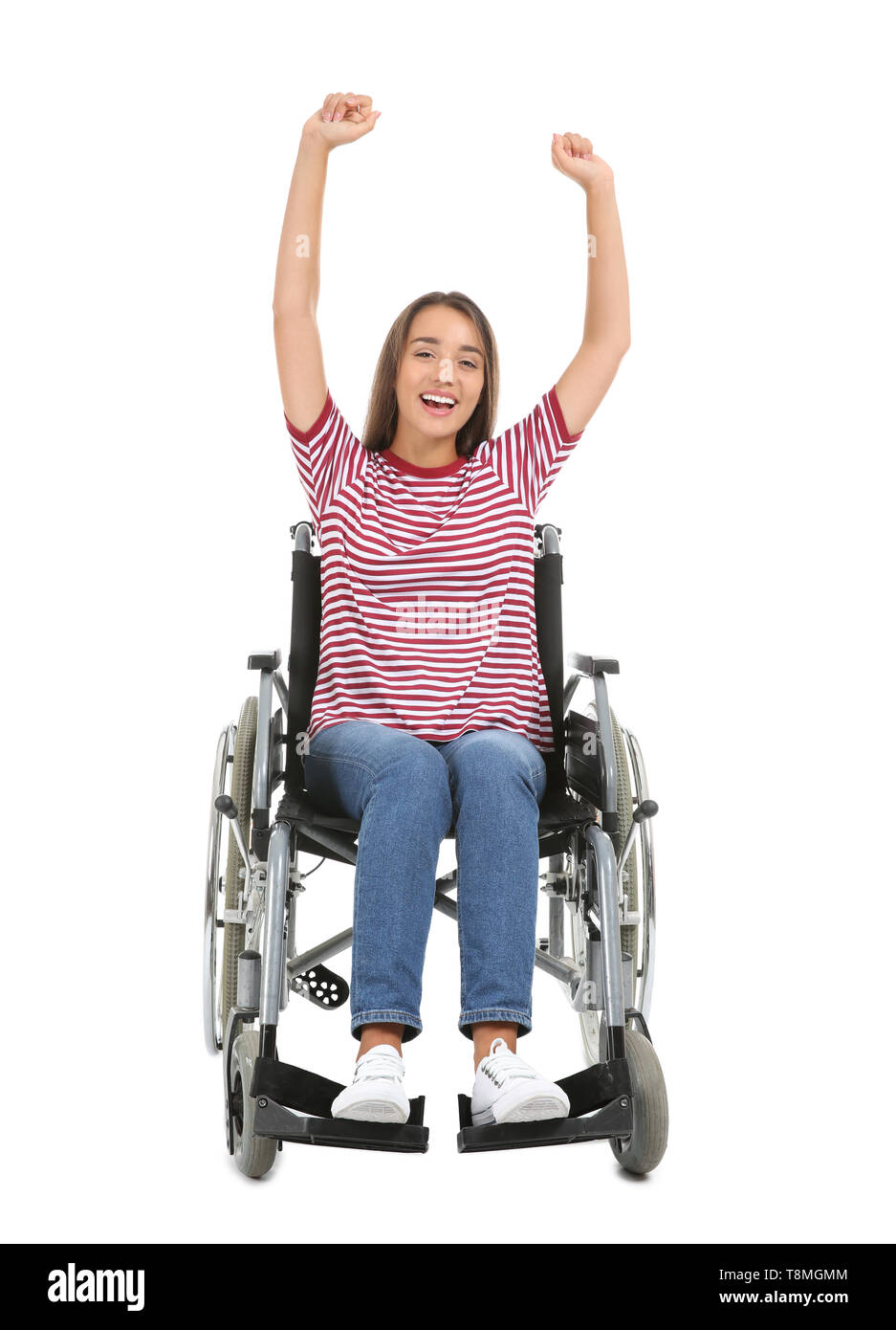 Happy young woman sitting in wheelchair on white background Stock Photo ...