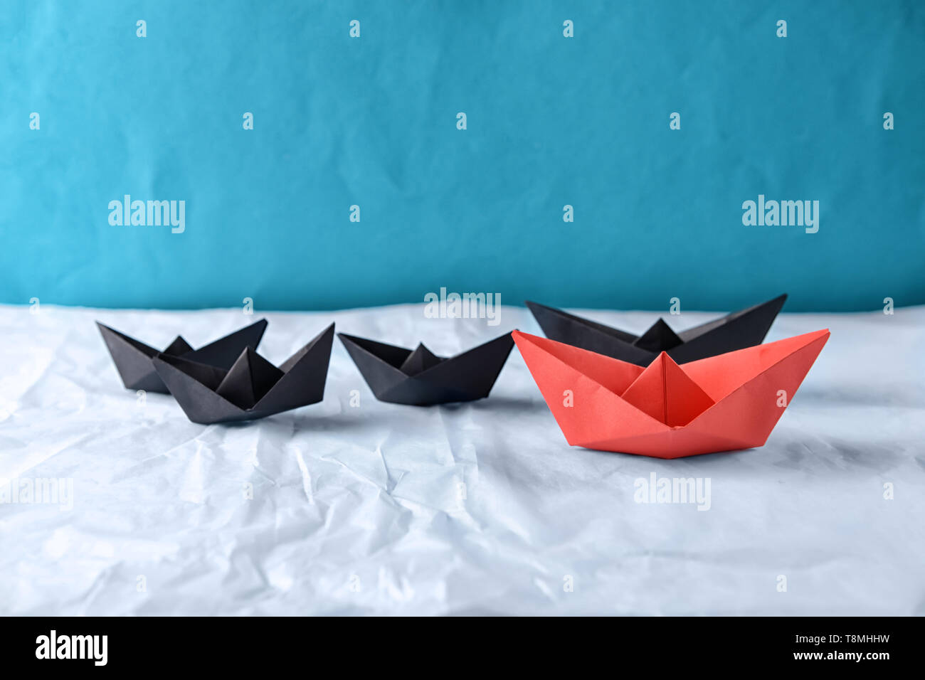 Origami Boats On Crumpled Paper Leadership Concept Stock Photo Alamy
