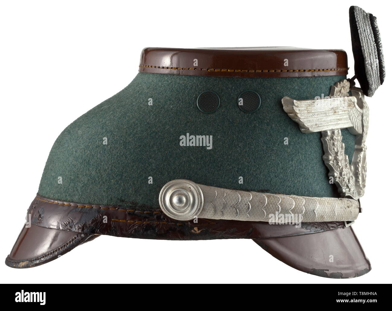 A shako for officers of the constabulary Fibre skull with police-green felt cover, brown lacquered visor and lid, brown silk rep liner, light brown leather sweatband, aluminium eagle, insignia of spun silver, silver-plated aluminium chin scales. Light signs of age. historic, historical, 20th century, Additional-Rights-Clearance-Info-Not-Available Stock Photo