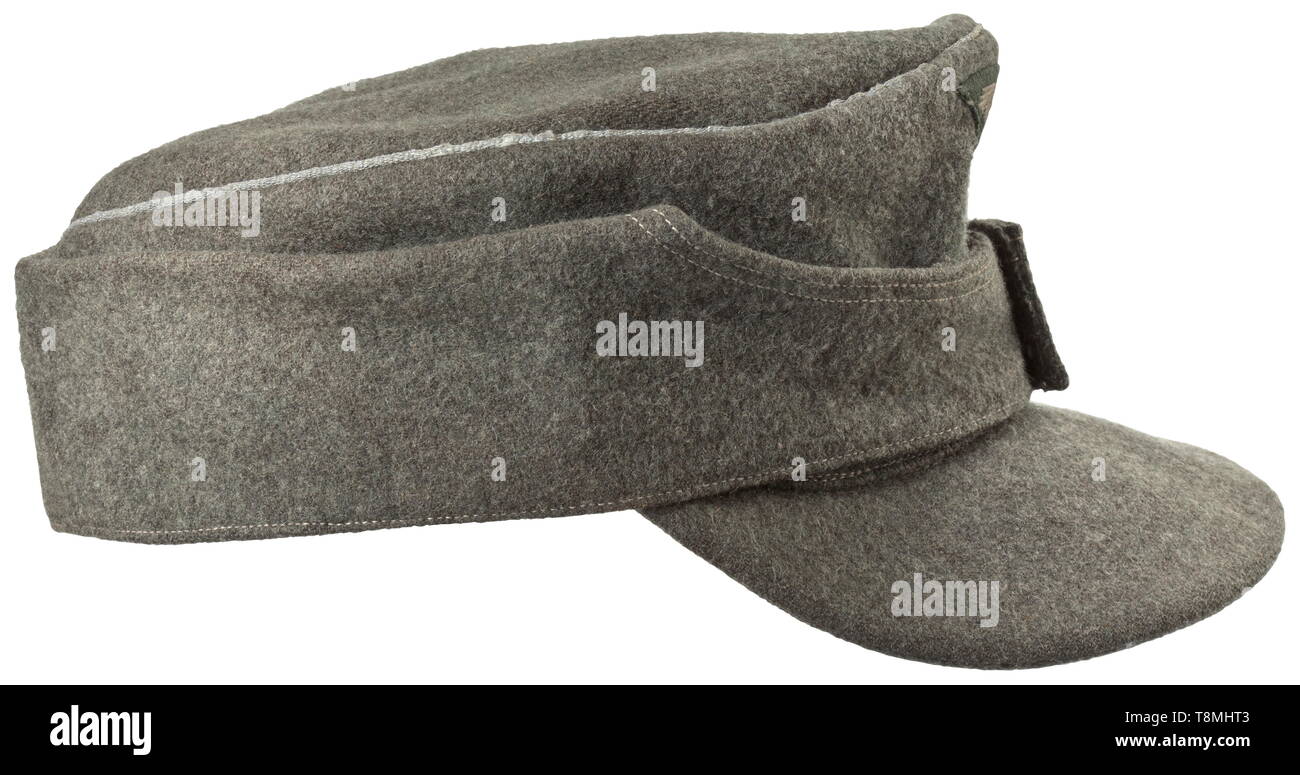 A field cap for Führer of the Waffen-SS mountain troops Field-grey woollen cloth with silver piping, two field-grey painted cap buttons, machine-sewn cap trapezoid (machine-woven), the left side with a sewn-in 'Edelweiß' on a black base. Light inner lining. Very rare. historic, historical, 20th century, 1930s, 1940s, Waffen-SS, armed division of the SS, armed service, armed services, NS, National Socialism, Nazism, Third Reich, German Reich, Germany, military, militaria, utensil, piece of equipment, utensils, object, objects, stills, clipping, clippings, cut out, cut-out, c, Editorial-Use-Only Stock Photo