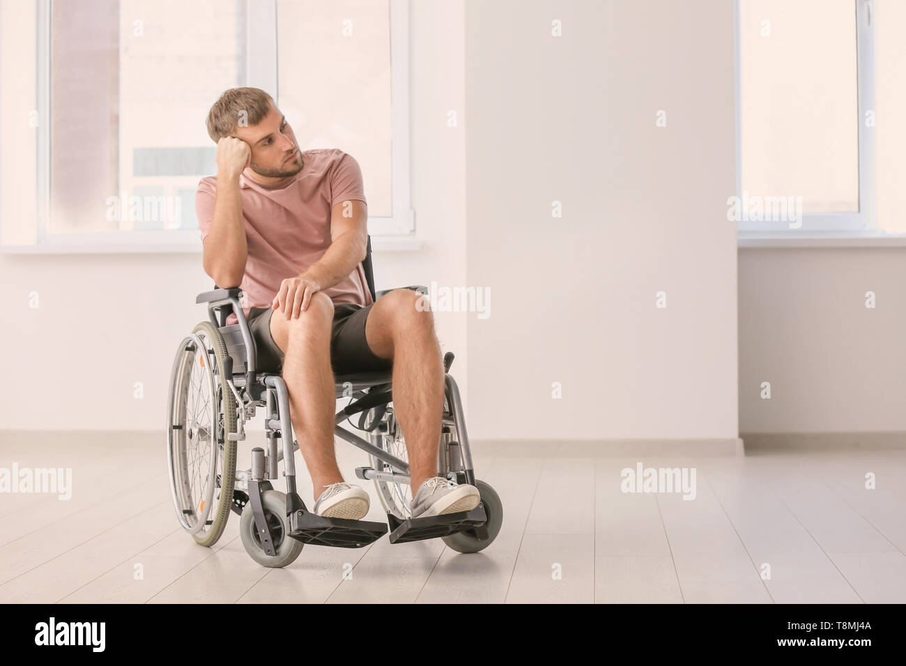 Invalid Room Depressed invalid man in empty room Stock Photo - Alamy