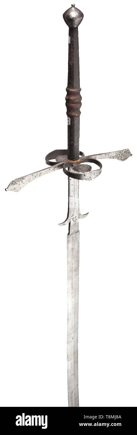 A South German two-hand sword, circa 1580 Broad, double-edged blade with a medial ridge on each side. Long ricasso with decorative lines and lugs separated on the sides. Extended quillons conically widening towards the ends, guard rings on both sides with mounted guard plates. Octagonal grip with central baluster, the original leather cover with grooved decoration is largely preserved. Round, double-tapering pommel. Length 165 cm. historic, historical, sword, swords, weapons, arms, weapon, arm, fighting device, military, militaria, object, object, Additional-Rights-Clearance-Info-Not-Available Stock Photo