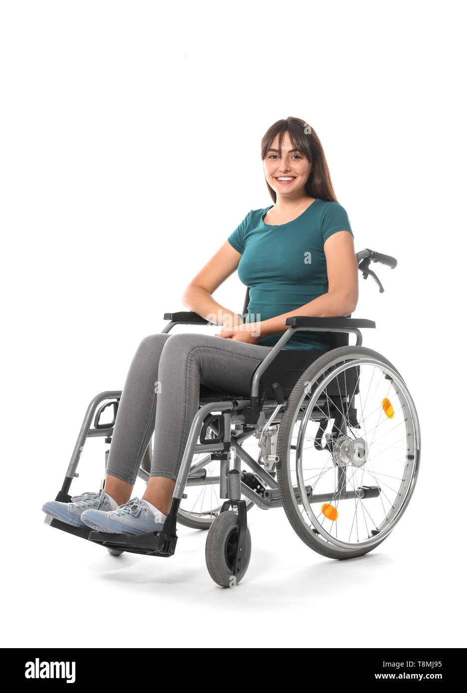 Young woman in wheelchair on white background Stock Photo - Alamy