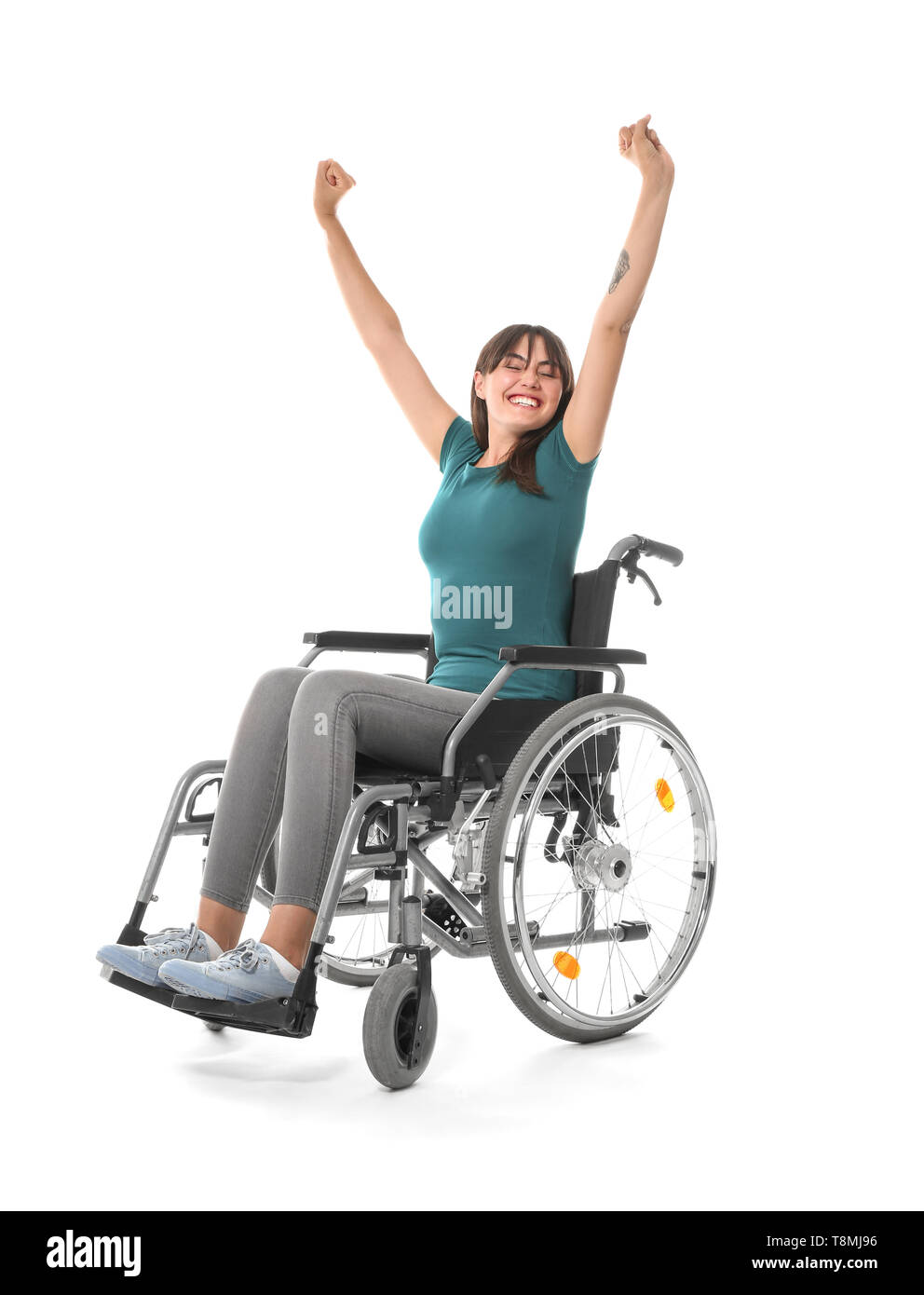 Happy young woman in wheelchair on white background Stock Photo - Alamy
