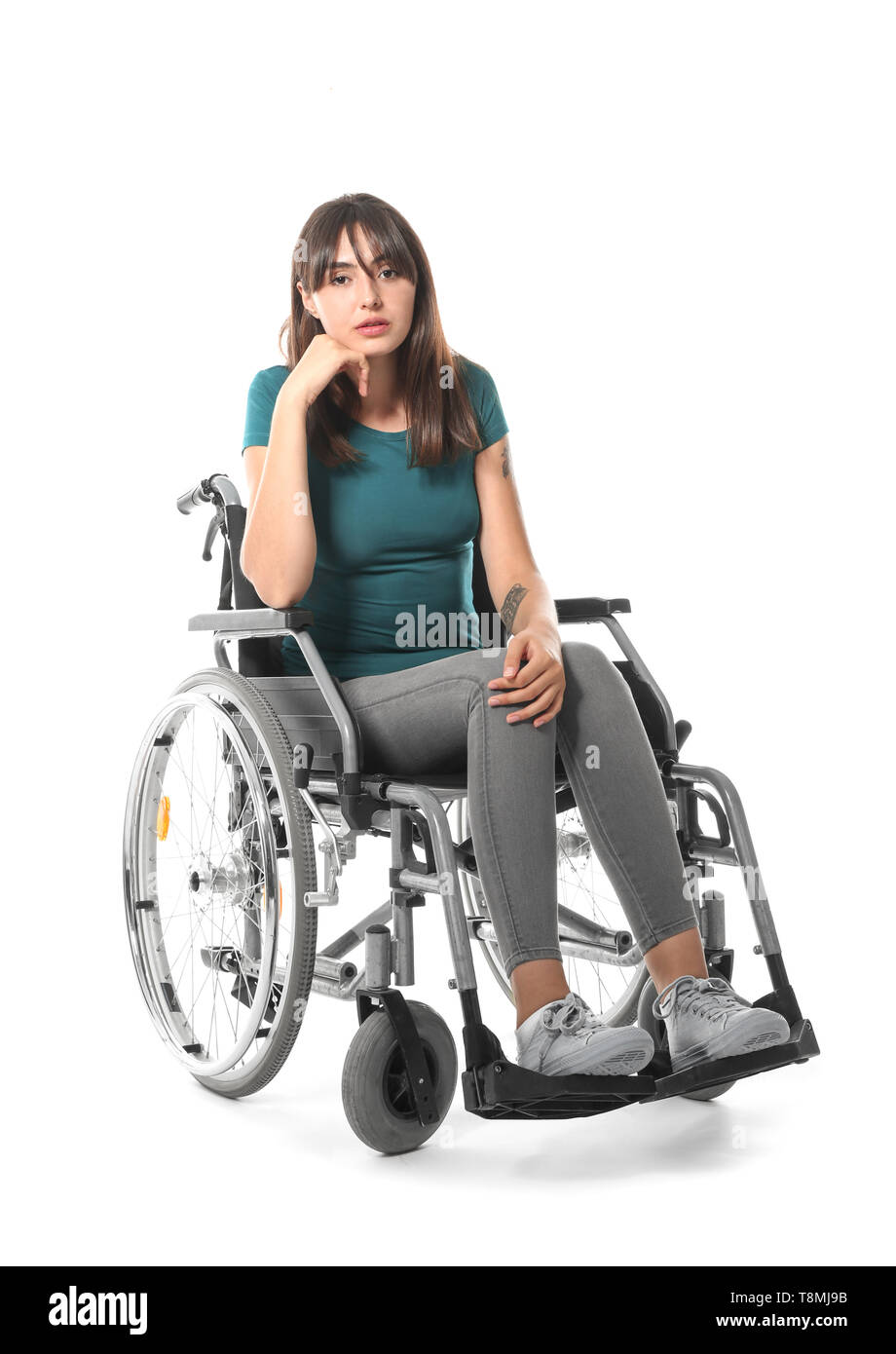 Young woman in wheelchair on white background Stock Photo - Alamy