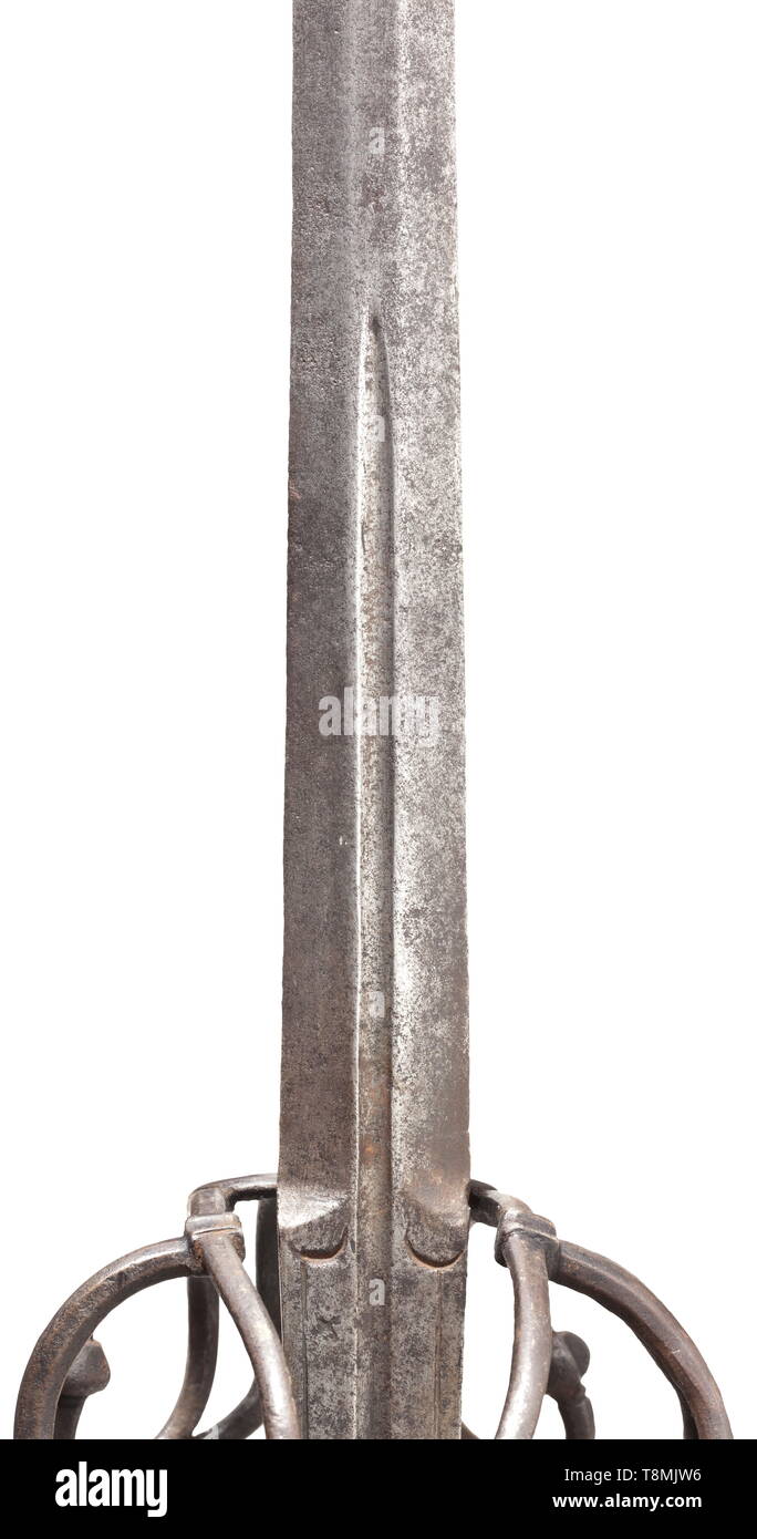 An Italian sword, end of the 16th century Sturdy blade of flattened  hexagonal section, with short fullers. Elaborate cut iron swept hilt, the  extended quillons decorated with grooved finials and curving towards
