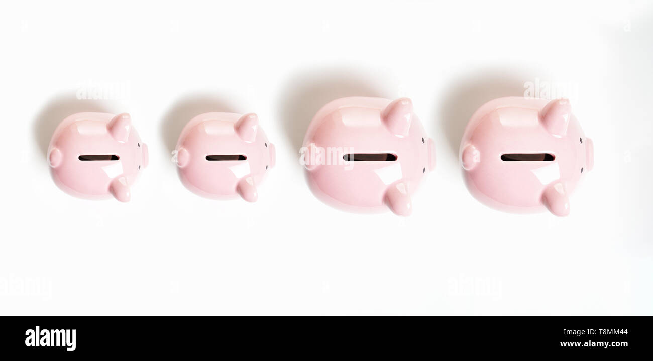 topview of piggy bank or piggybank family - financial growth or capital gain concept Stock Photo