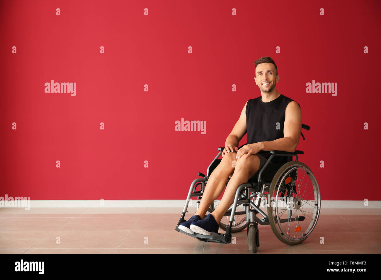 Young man sitting in wheelchair hi-res stock photography and images - Alamy