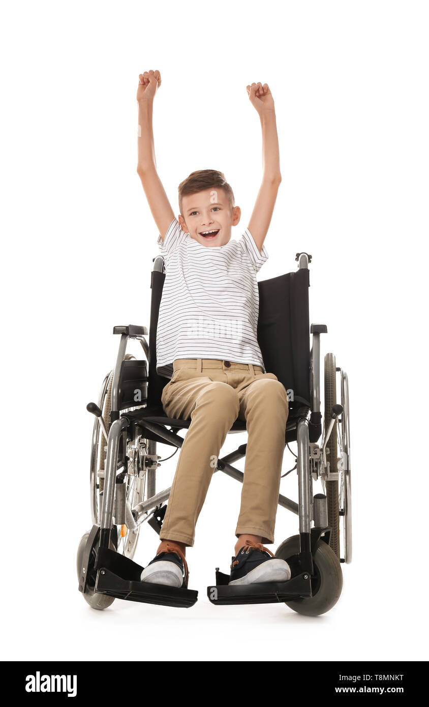 Happy boy in wheelchair on white background Stock Photo