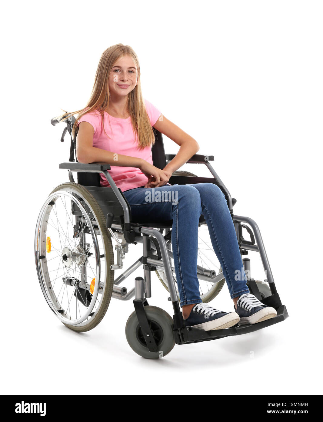Teenage girl in wheelchair on white background Stock Photo - Alamy