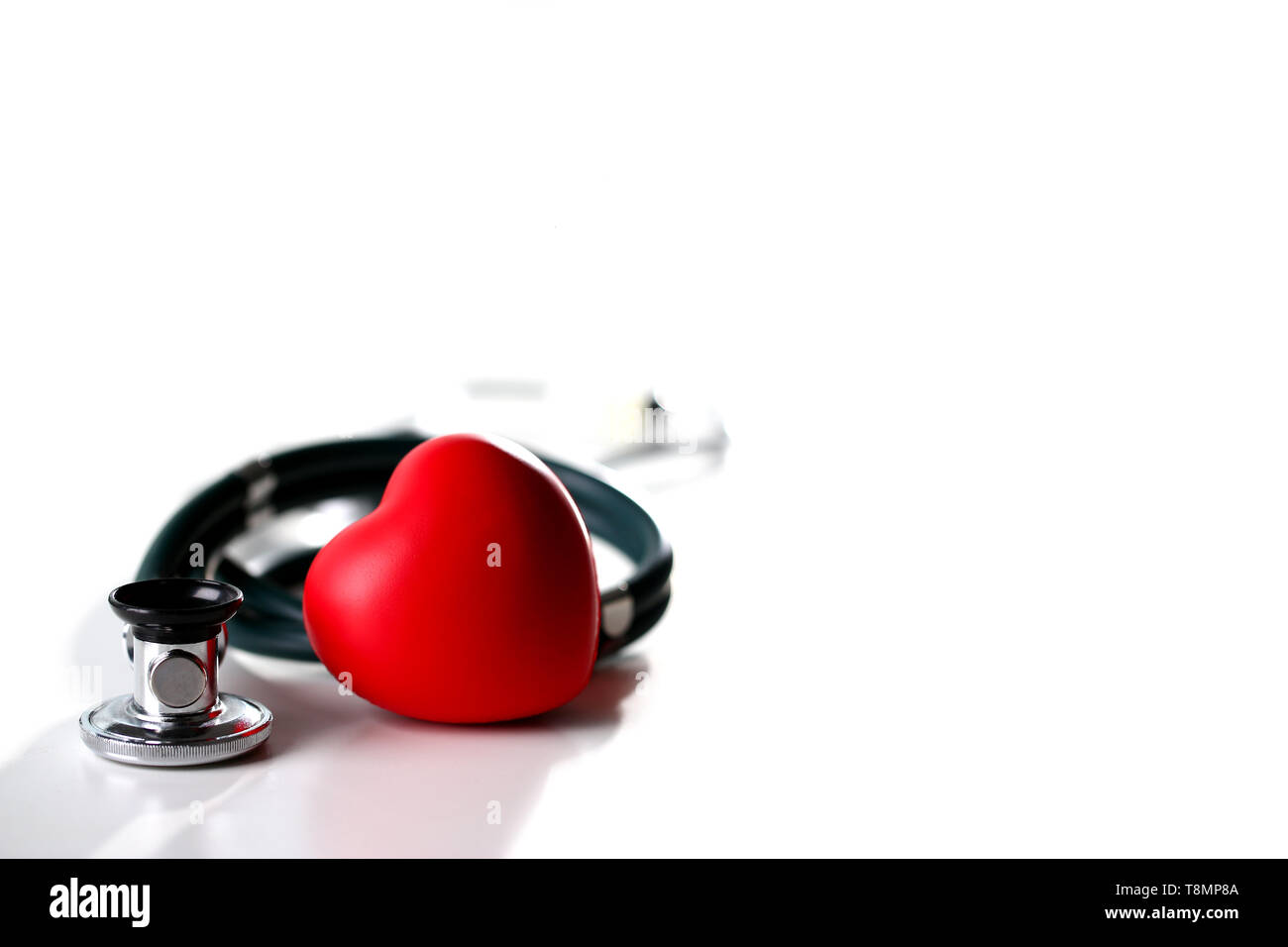 Red heart and a stethoscope on a white Stock Photo - Alamy
