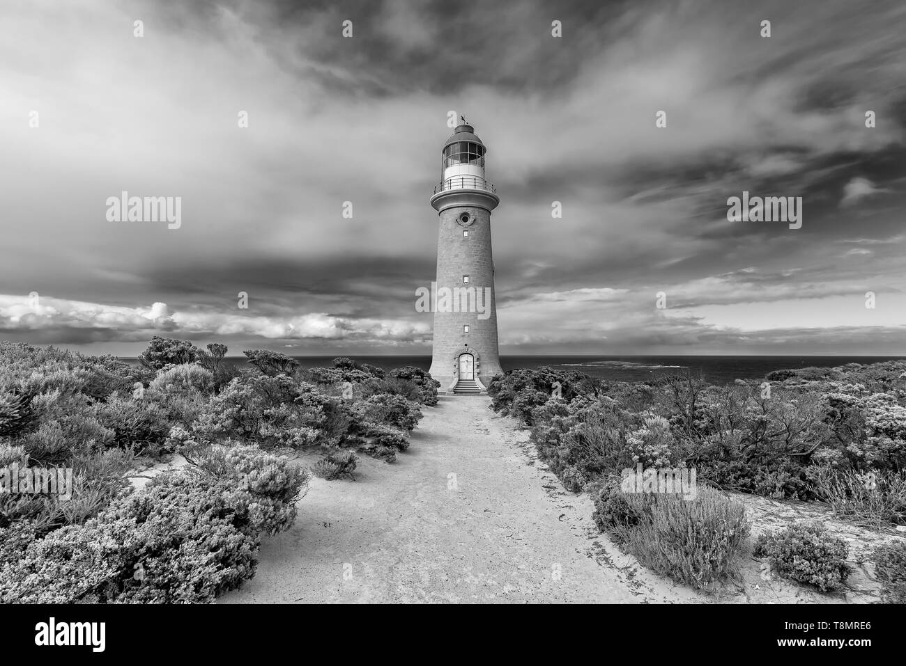 The beautiful Cape du Couedic Lighthouse in black and white on a day with dramatic sky, Kangaroo Island, Southern Australia Stock Photo