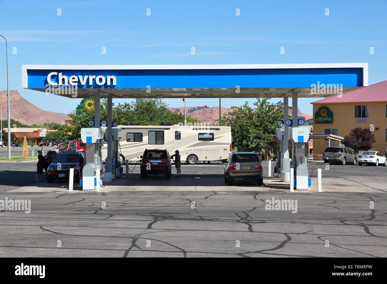 MOAB, USA JUNE 22, 2013 People fill up their cars at Chevron gas