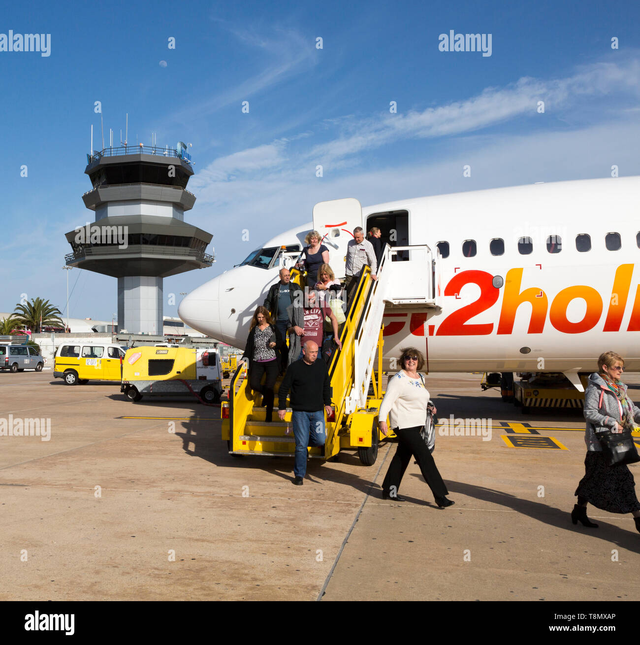 Jet2 package holiday plane passengers disembarking at the airport Faro