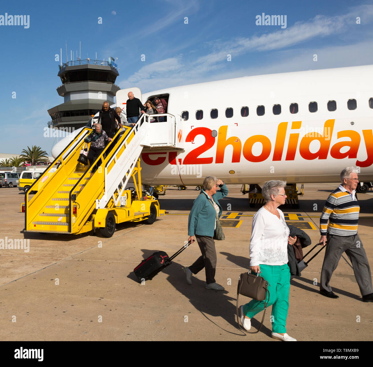 Jet2 package holiday plane passengers disembarking at the airport Faro