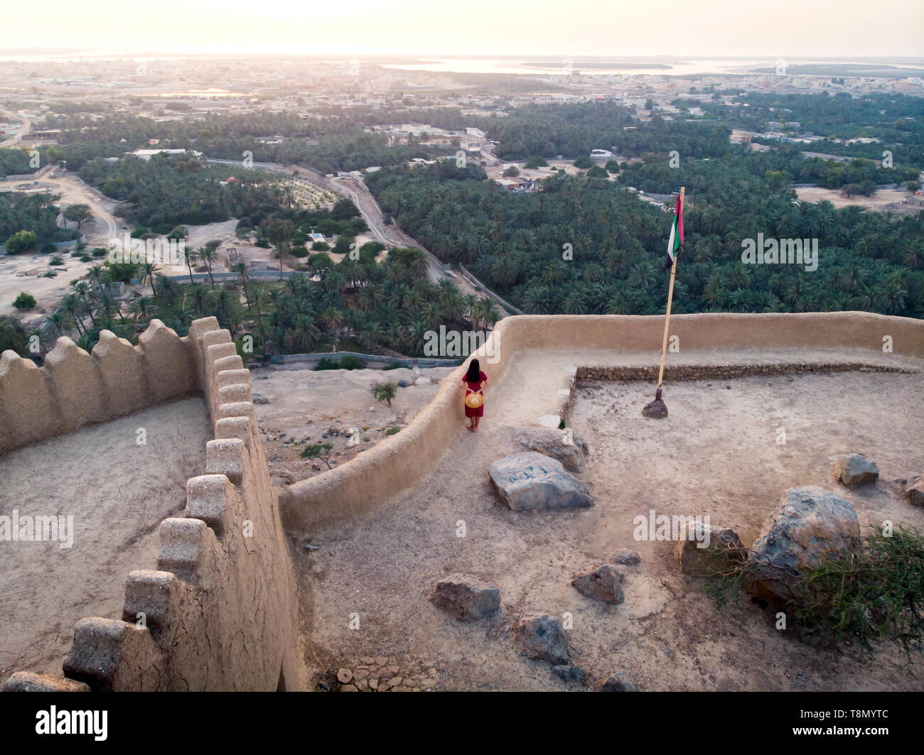 Woman enjoying sunset view from Dhayah fort in Ras Khaimah emirate in ...