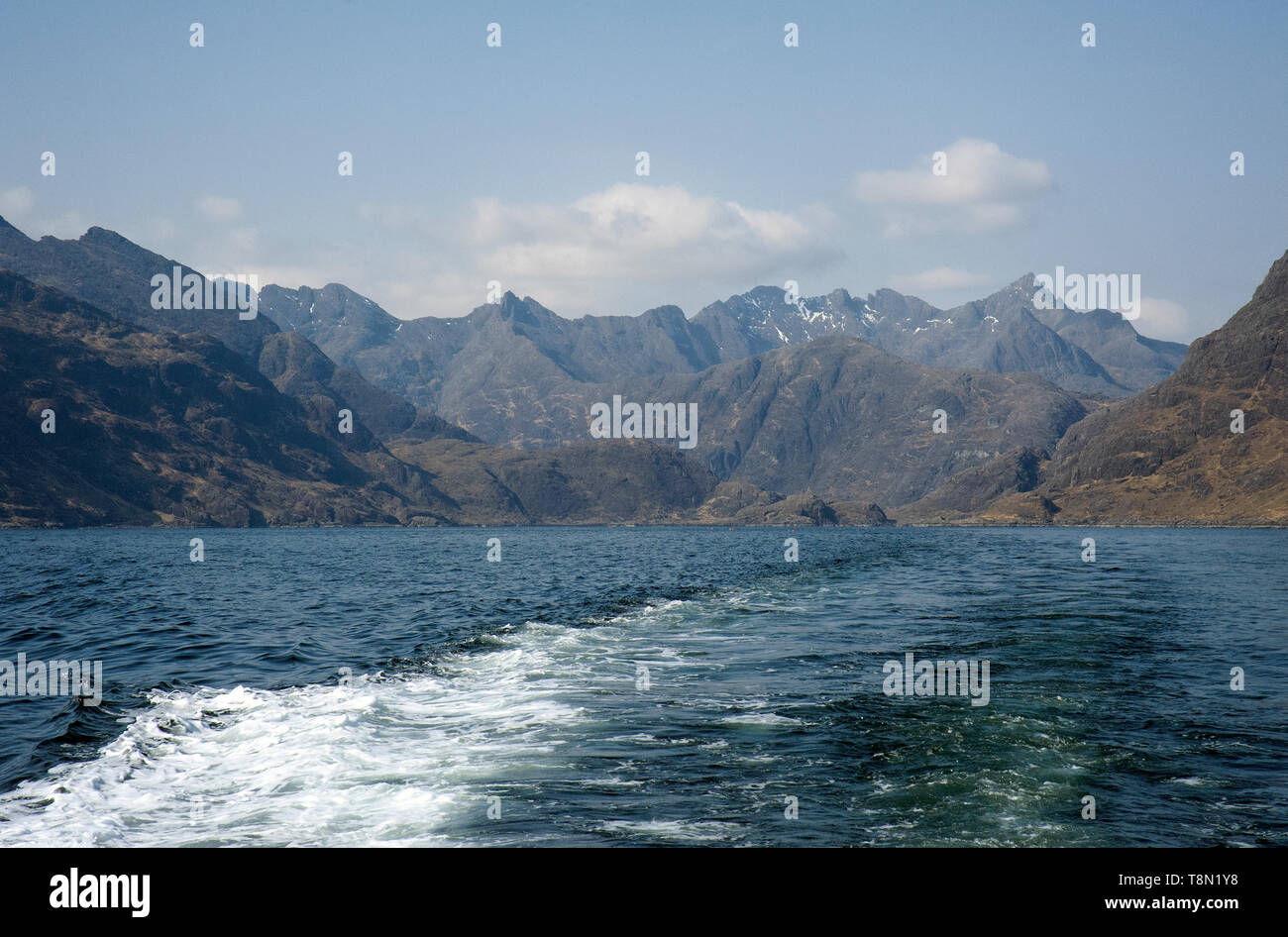 Travelling across Loch Scavaig towards Elgol on the Bella Jane tour boat with the Black Cullin mountains of the Isle of Skye in the background. Stock Photo