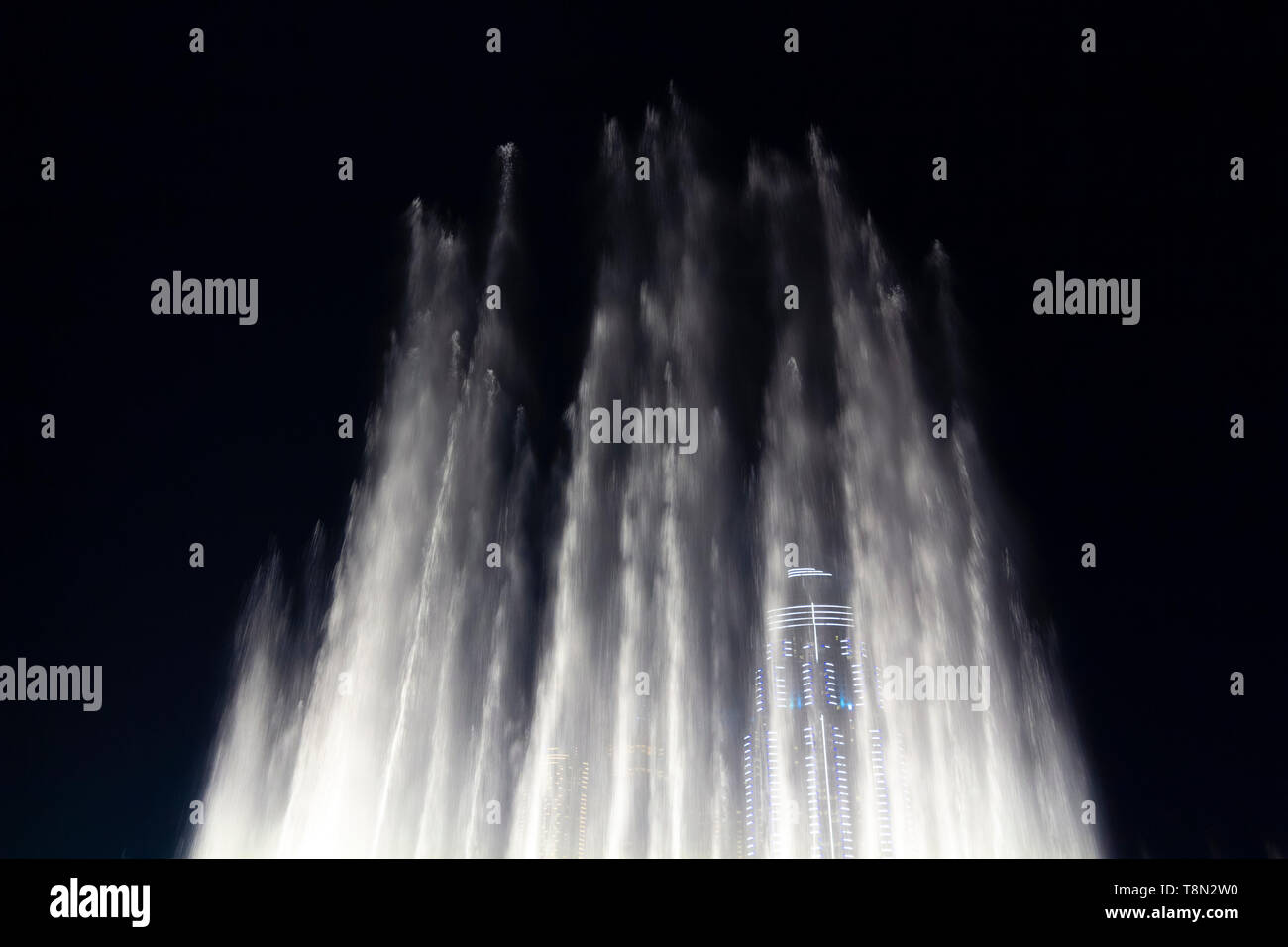 Fountains with lighting in the center of the night city Stock Photo - Alamy