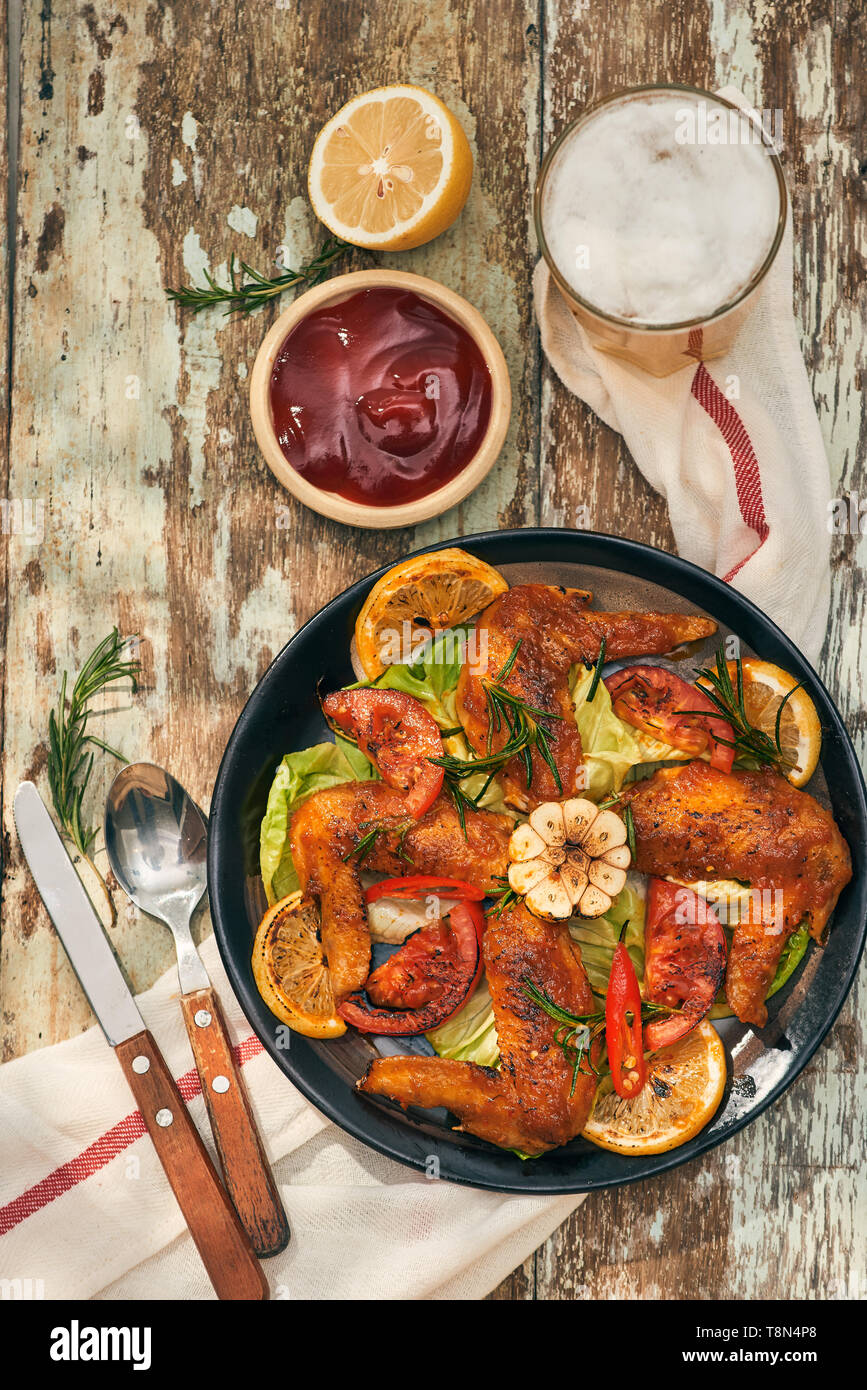 Grilled drumstick of chicken in spicy marinade with the addition of chili Stock Photo Alamy