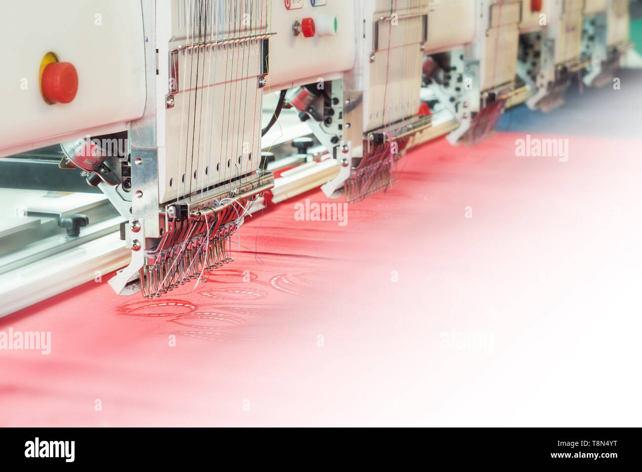 Industrial embroidery machine in textile production Stock