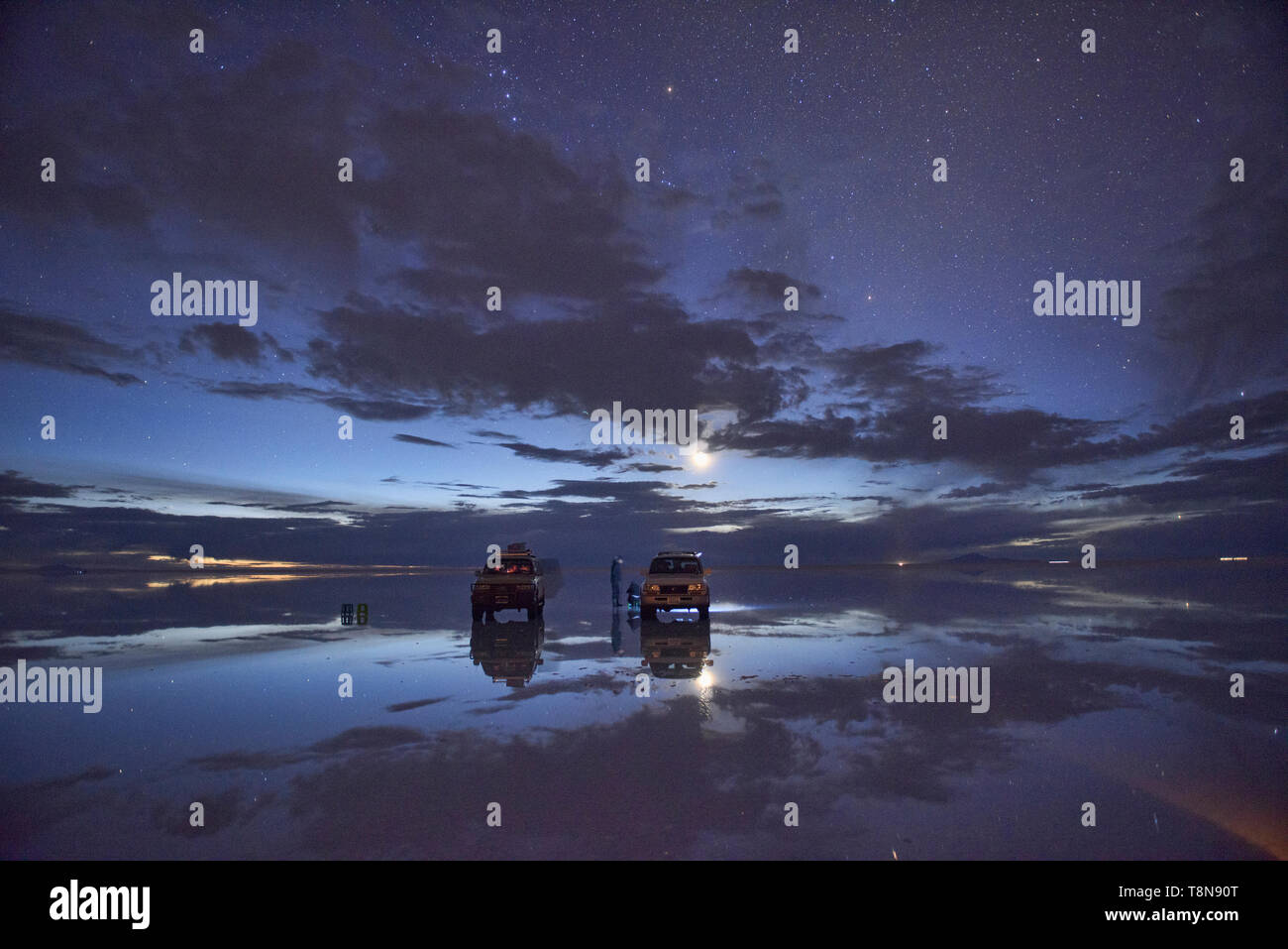 The stars and moon reflections on the Salar de Uyuni, Bolivia Stock