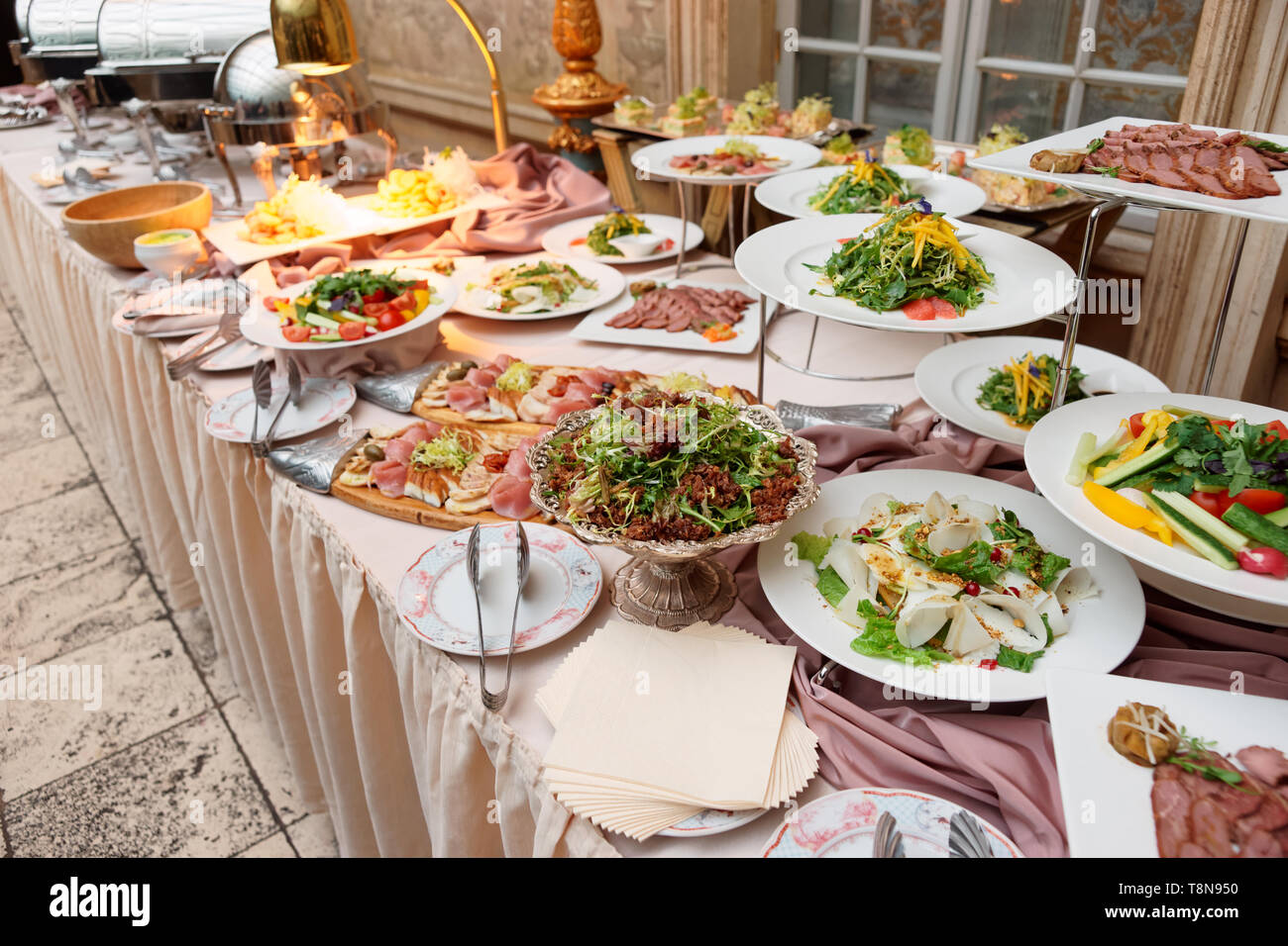 Catering table full of food, no people Stock Photo - Alamy