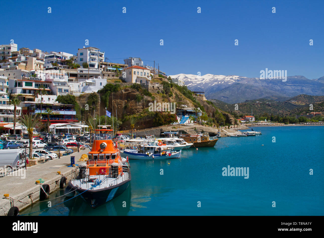 View on the charming fisherman’s village Agia Galini on the South coast of Crete, in the background the snow-covered Idi Mountains Stock Photo