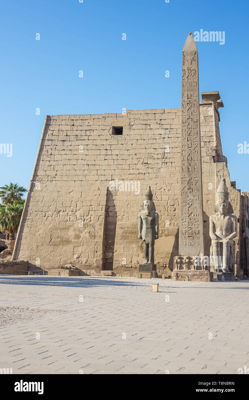 The right hand side of the Temple of Luxor with an obelisk and statues of Ramesses II Stock Photo