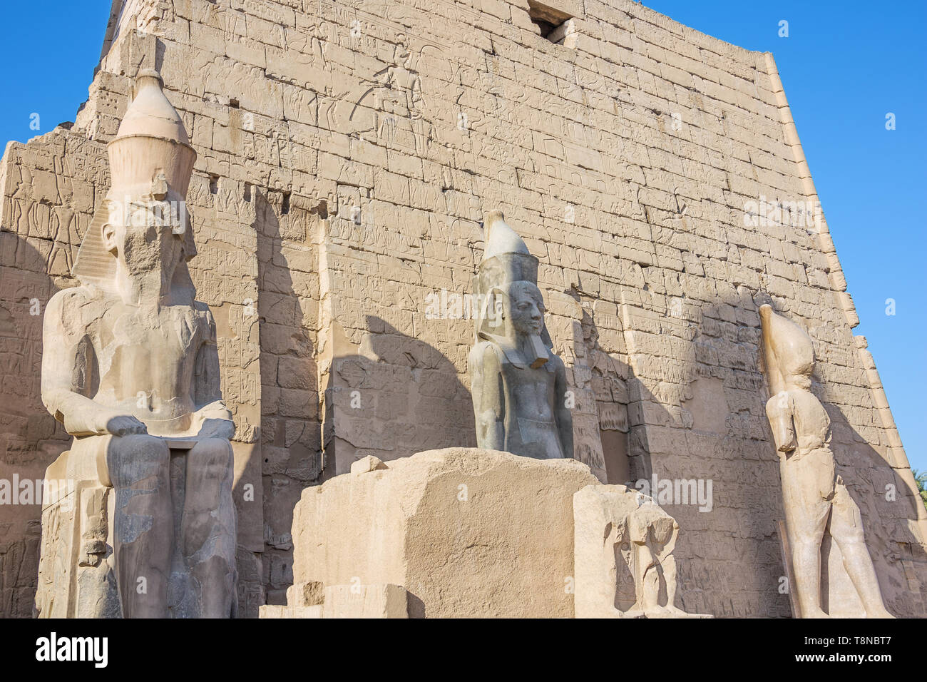Close up of three the statue of Ramesses II at the entrance of the temple of Luxor Stock Photo